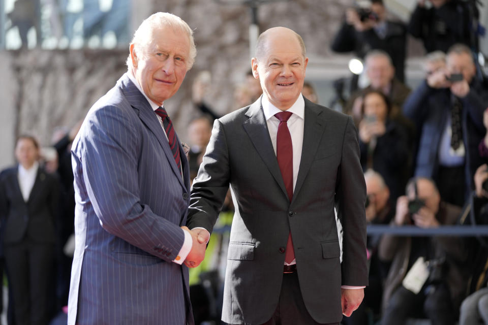 German Chancellor Olaf Scholz welcomes Britain's King Charles III at the chancellery in Berlin, Thursday, March 30, 2023. King Charles III arrived Wednesday for a three-day official visit to Germany. (AP Photo/Matthias Schrader)