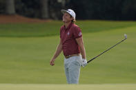 Cameron Smith, of Australia, watches his chip to the 18th green during the final round of the Masters golf tournament Sunday, Nov. 15, 2020, in Augusta, Ga. (AP Photo/Charlie Riedel)