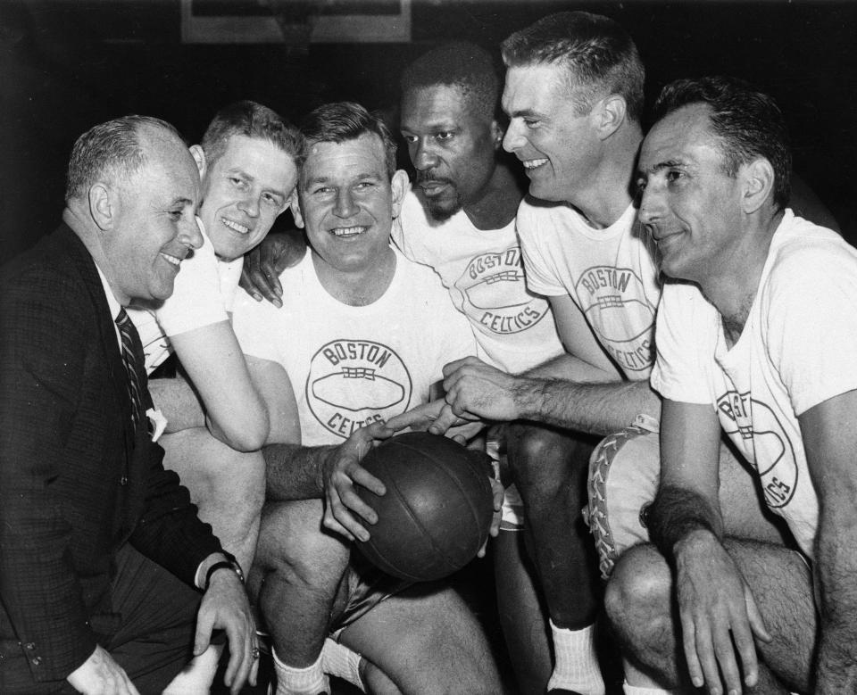 FILE - In this March 28, 1963, file photo, Boston Celtics coach Red Auerbach, left, huddles with veteran players before a basketball game against the Cincinnati Royals in Boston. From left are coach Auerbach, Frank Ramsey, Jim Loscutoff, Bill Russell, Tom Heinsohn and captain Bob Cousy. (AP Photo/File)