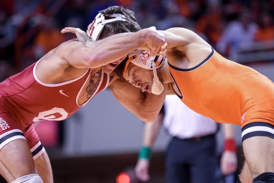 Oklahoma’s Joey Prata faces off against Oklahoma State’s Reece Witcraft during a college wrestling meet between the Oklahoma State Cowboys (OSU) and the Oklahoma Sooners at Gallagher-Iba Arena in Stillwater, Okla., Thursday, Feb. 16, 2023.