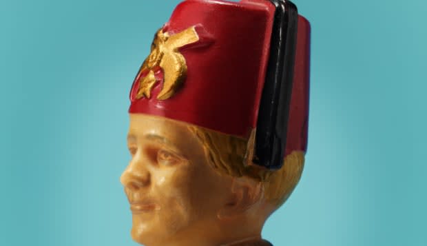 Plastic Man Wearing Fez