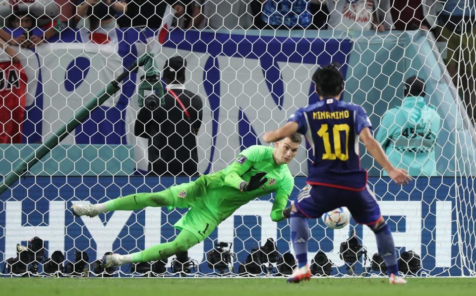 Dominik Livakovic of Croatia saves the first penalty from Takumi Minamino - Alex Grimm/Getty Images