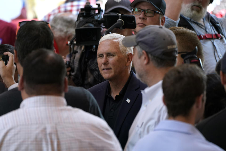 Former Vice President Mike Pence greets audience members during U.S. Sen. Joni Ernst's Roast and Ride, Saturday, June 3, 2023, in Des Moines, Iowa. (AP Photo/Charlie Neibergall)