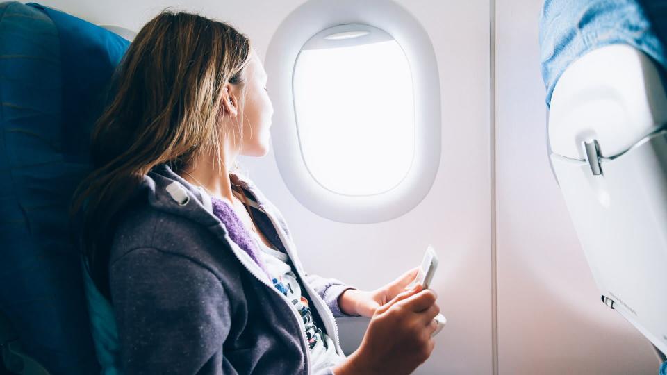 girl sitting on airplane