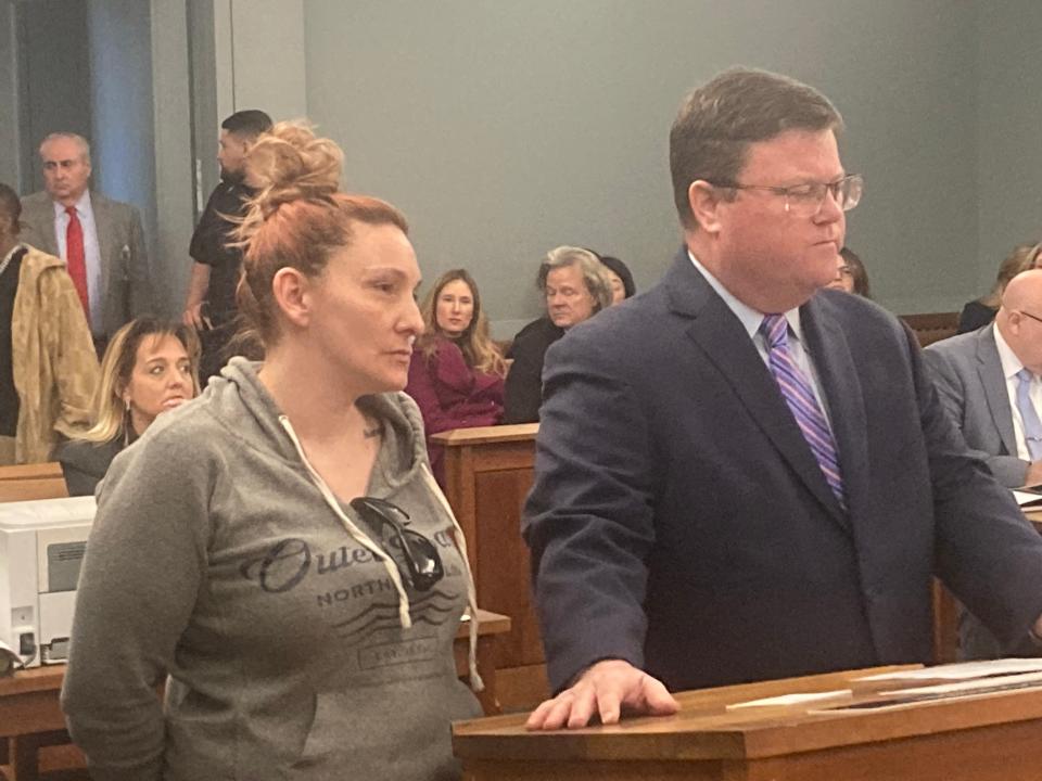 Amanda Wallace with attorney Keith O'Halloran in court in Central Islip on Monday, March 18.