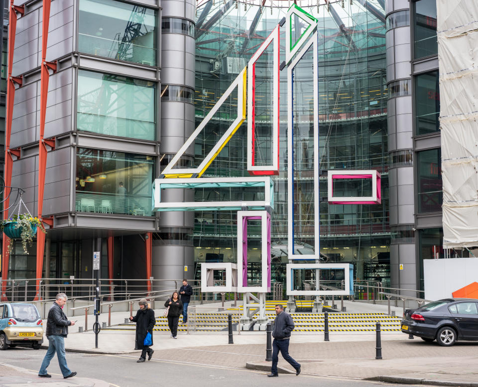 London, UK - Pedestrians on the street in front of the headquarters building of the UK television broadcaster Channel 4, located in Westminster. Credit: Getty.