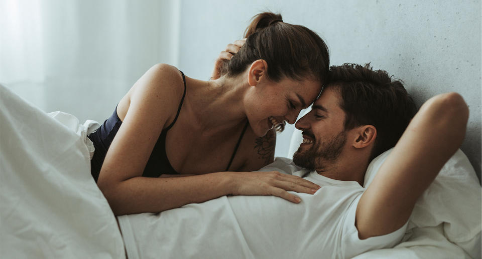 Couple in bed together. (Getty Images)