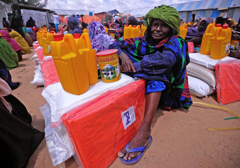 A Somali woman displaced by drought waits for food and water at an aid distribution centre outside Mogadishu on April 6, 2017.