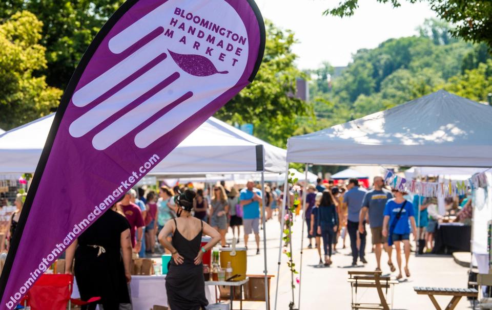 Flags signal one end of the Bloomington Handmade Market along Kirkwood Avenue June 12, 2021.