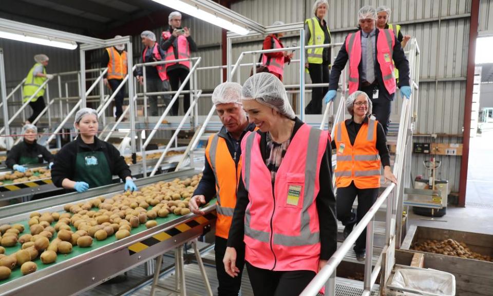 New Zealand’s prime minister, Jacinda Ardern, visits a kiwi-packing plant