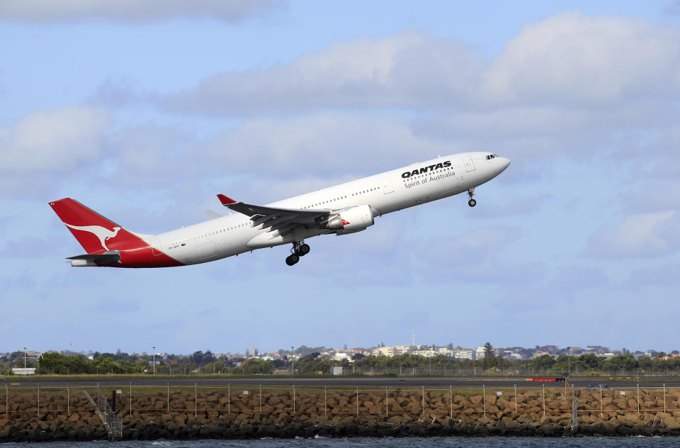 A Qantas jetliner takes off from Sydney Airport in Sydney,