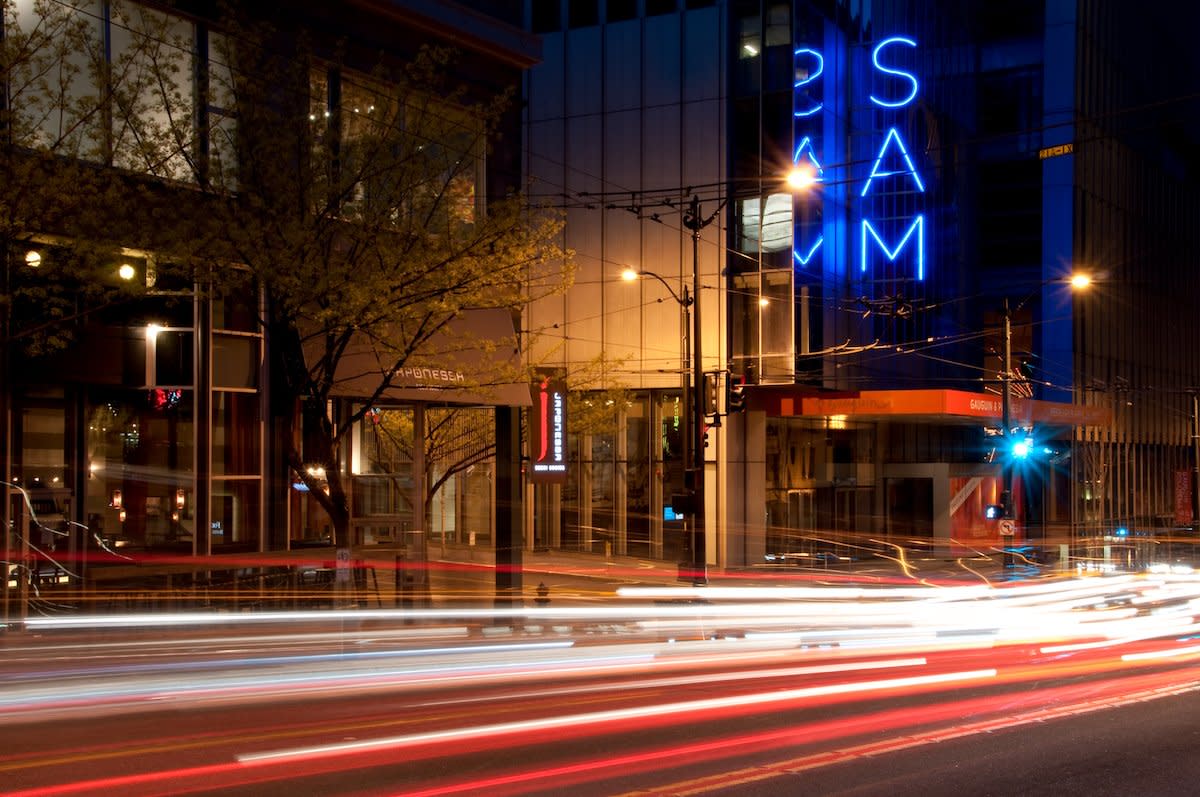 The Seattle Art Museum sign, also known as SAM by locals, is captured with a long exposure.