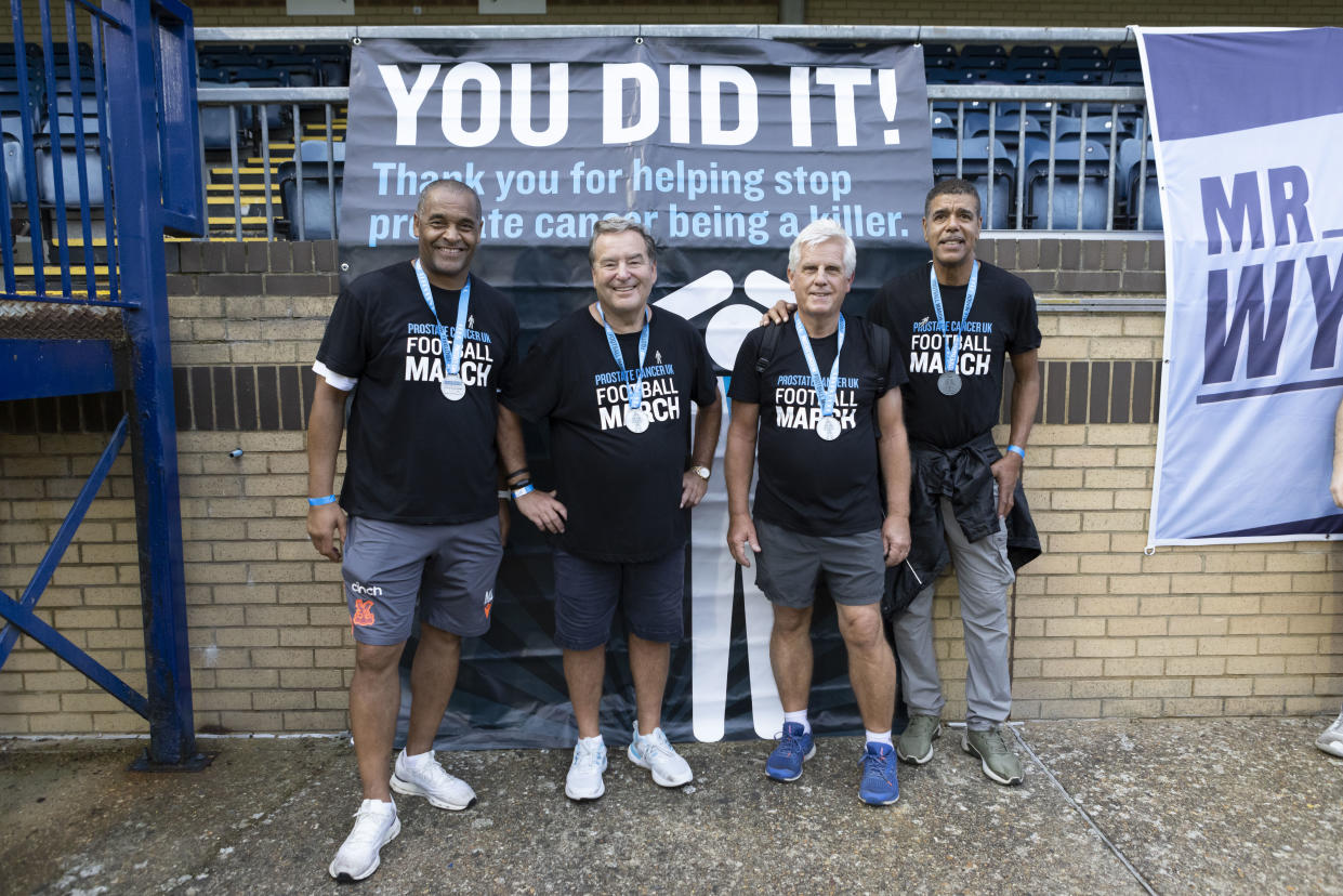 Mark Bright, Jeff Stelling, Steve Rider, Chris Kamara after finishing Jeff Stelling’s latest charity Football March (Prostate Cancer UK/PA)