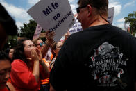 <p>A man attending a 2nd amendment rally yells at counter-protesters outside of the U.S. Supreme Court in Washington, U.S., June 26, 2018.(Photo: Leah Millis/Reuters) </p>