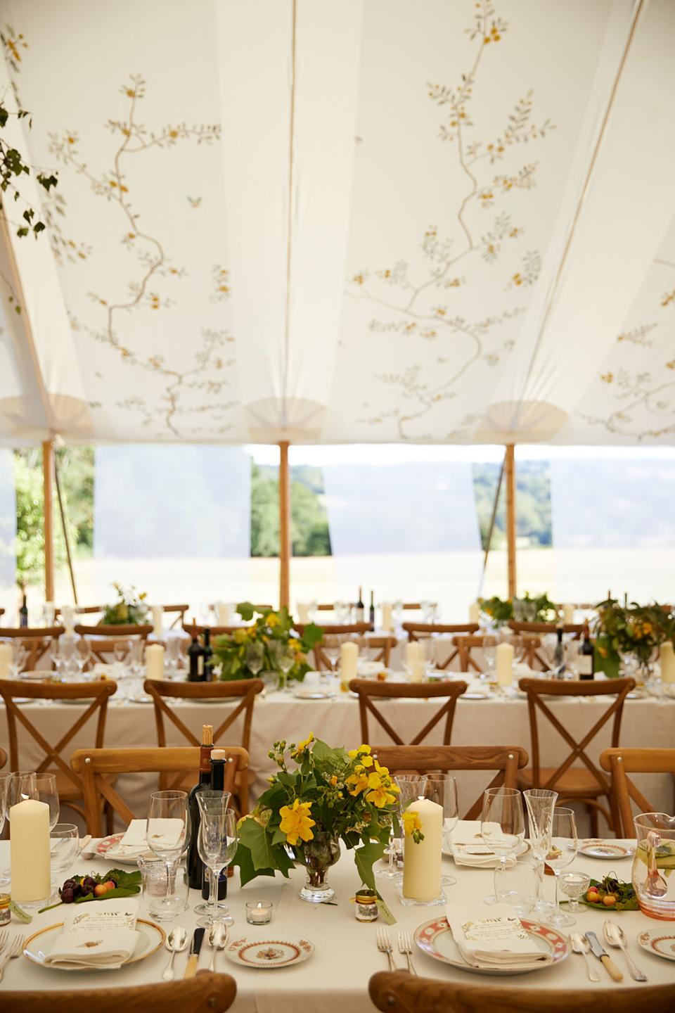 I’d gathered wild flowers from the surrounding countryside in my chosen color palette of yellows, whites, and greens for the tables.