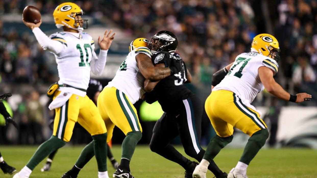 <div>PHILADELPHIA, PA - NOVEMBER 27: Elgton Jenkins #74 of the Green Bay Packers blocks Javon Hargrave #97 of the Philadelphia Eagles during an NFL football game at Lincoln Financial Field on November 27, 2022 in Philadelphia, Pennsylvania. (Photo by Kevin Sabitus/Getty Images)</div>