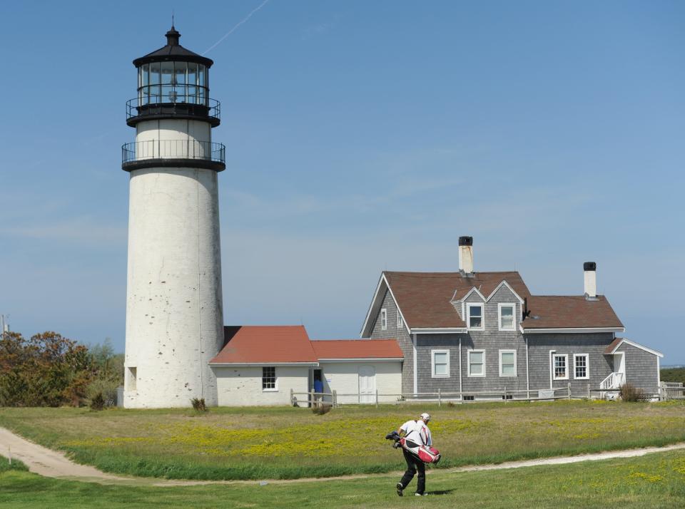 Highland Light keeps watch on a past golfer at Highland Links Golf Course.