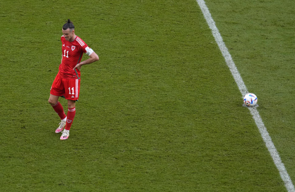 Wales' Gareth Bale reacts after Iran's Ramin Rezaeian scoring his side's second goal during the World Cup group B soccer match between Wales and Iran, at the Ahmad Bin Ali Stadium in Al Rayyan , Qatar, Friday, Nov. 25, 2022. (AP Photo/Manu Fernandez)