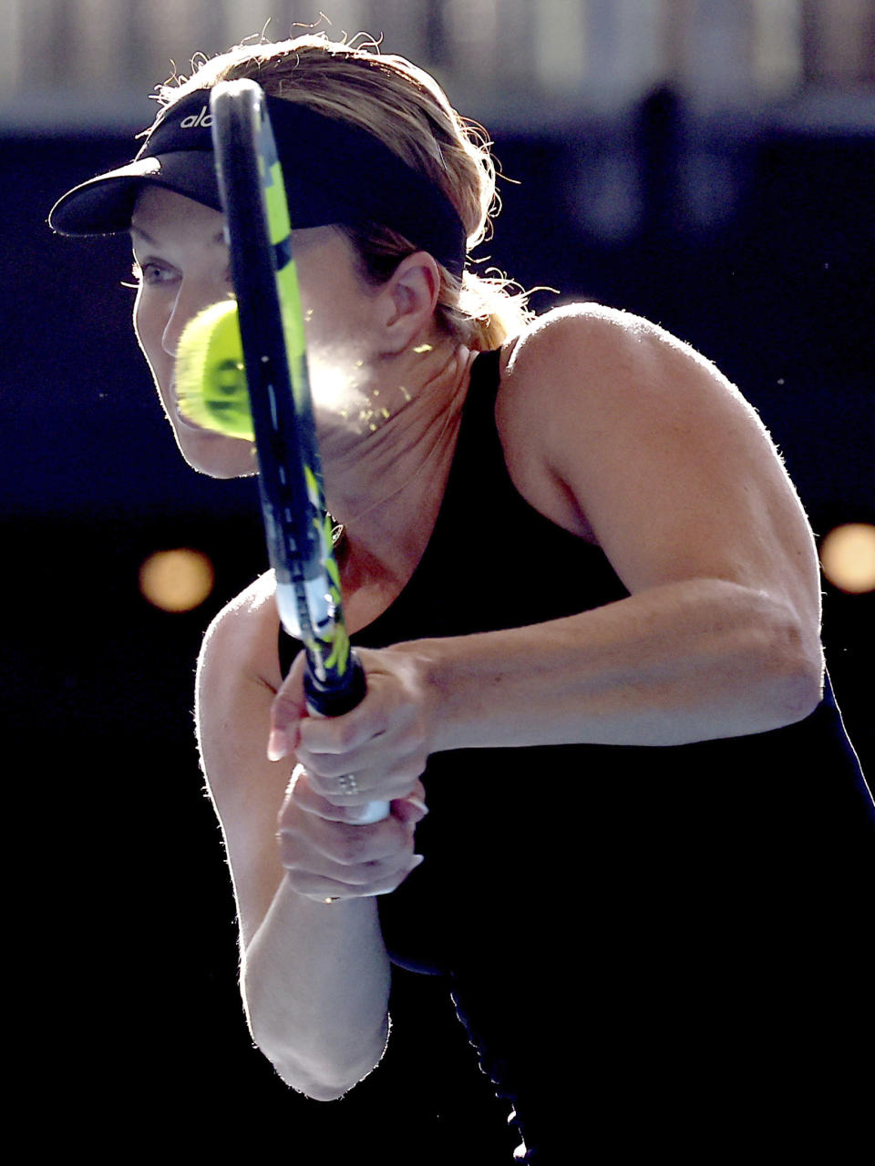 Danielle Collins of the U.S. makes a backhand return to Elena Rybakina of Kazakhstan during their Round of 32 match at the Adelaide International Tennis tournament in Adelaide, Australia, Monday, Jan. 2, 2023. (AP Photo/Kelly Barnes)