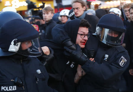 Police detain a protester during a left wing May Day demonstration in Berlin, Germany, May 1, 2019. REUTERS/Hannibal Hanschke