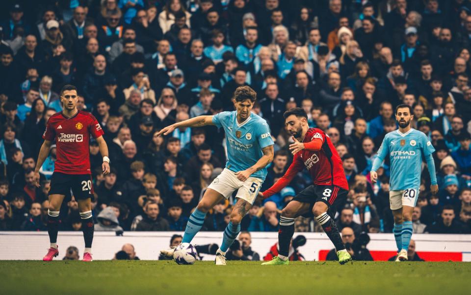 John Stones brings the ball out of defence