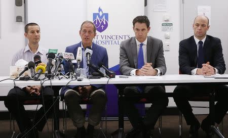 Doctor Tony Grabs (L-R), head of St Vincent's Hospital Trauma department, Cricket Australia team doctor Peter Brukner, Cricket Australia Chief Executive James Sutherland and Australian Cricketers Association chief executive Alistair Nicholson attend a news conference following the death of Australian cricketer Phillip Hughes, at St Vincent's Hospital in Sydney, November 27, 2014. REUTERS/Jason Reed