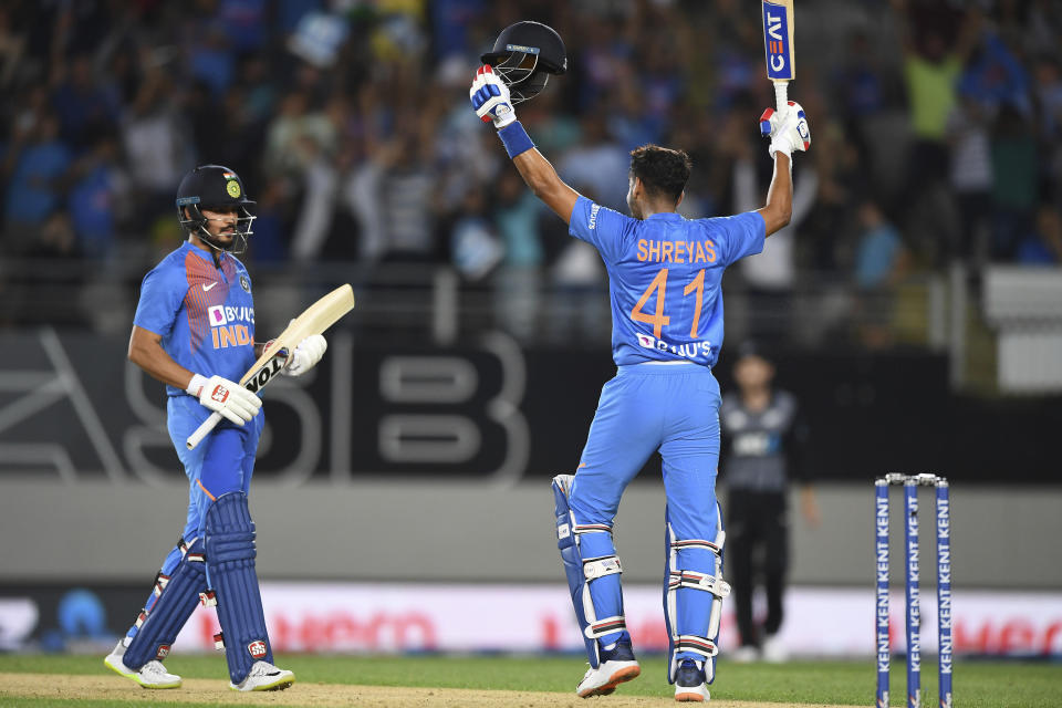 India's Manish Pandy and Shreyas Iyer, right, celebrate during the Twenty/20 cricket international between India and New Zealand in Auckland, New Zealand, Friday, Jan. 24, 2020. (Andrew Cornaga/Photosport via AP)