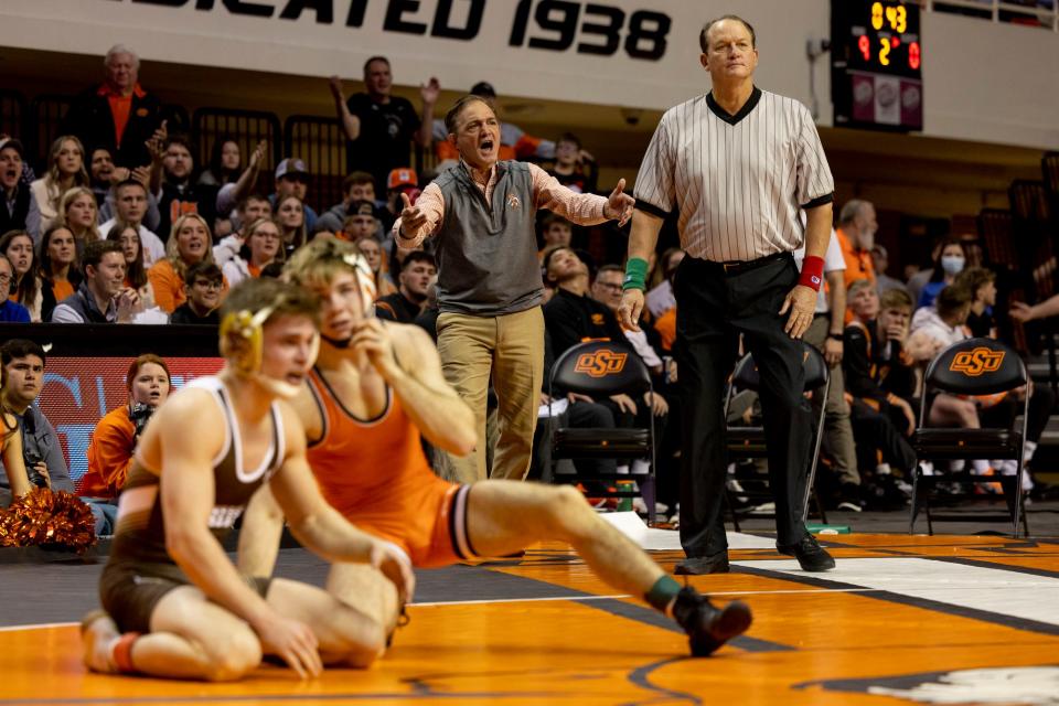 Oklahoma State coach John Smith yells from the sideline during Sunday's wrestling match against Lehigh at Gallagher-Iba Arena in Stillwater.