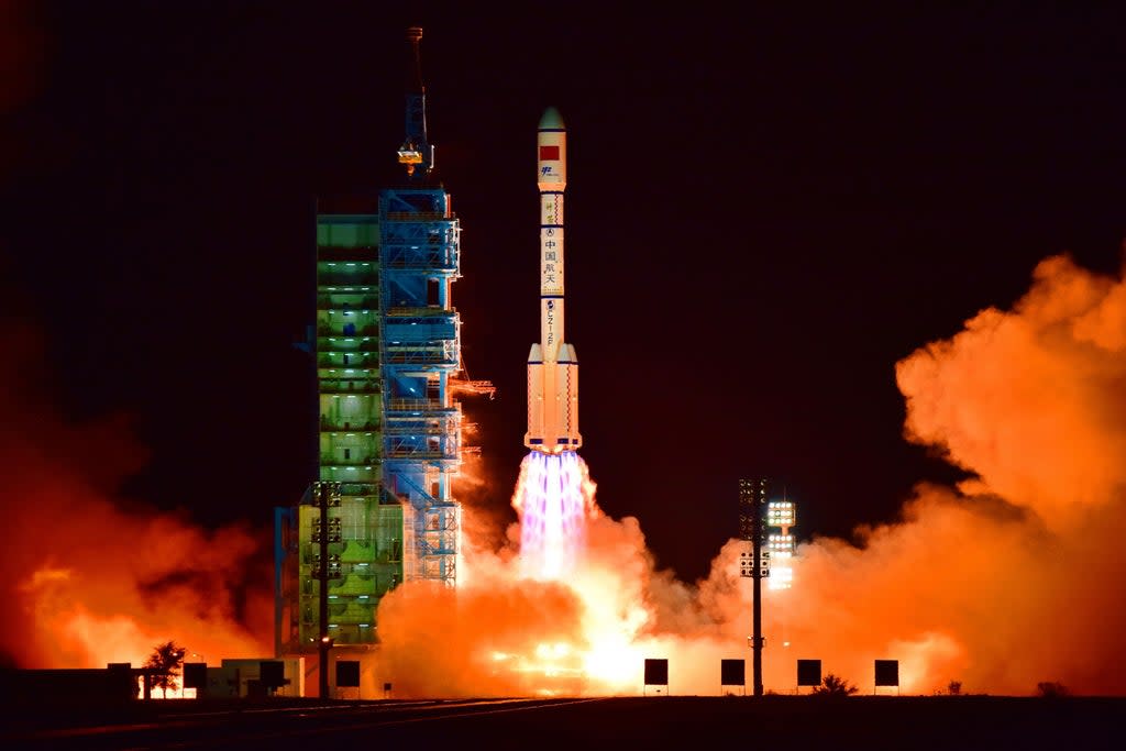 File. China’s Tiangong 2 space lab is launched on a Long March-2F rocket from the Jiuquan Satellite Launch Center in the Gobi Desert, in China’s Gansu province, on 15 September 2016. Elon Musk, the owner of Tesla is facing a massive backlash on Chinese social media after it came to light that Beijing had to take measures to avoid its space station from colliding with Musk’s satellites twice  (AFP via Getty Images)