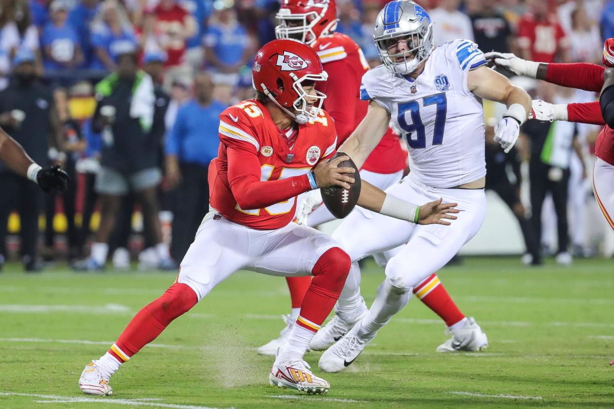 Detroit Lions defensive end Aidan Hutchinson (97) looks to tackle Kansas City Chiefs quarterback Patrick Mahomes (15) during the second half at Arrowhead Stadium in Kansas City, Mo. on Thursday, Sept. 7, 2023.