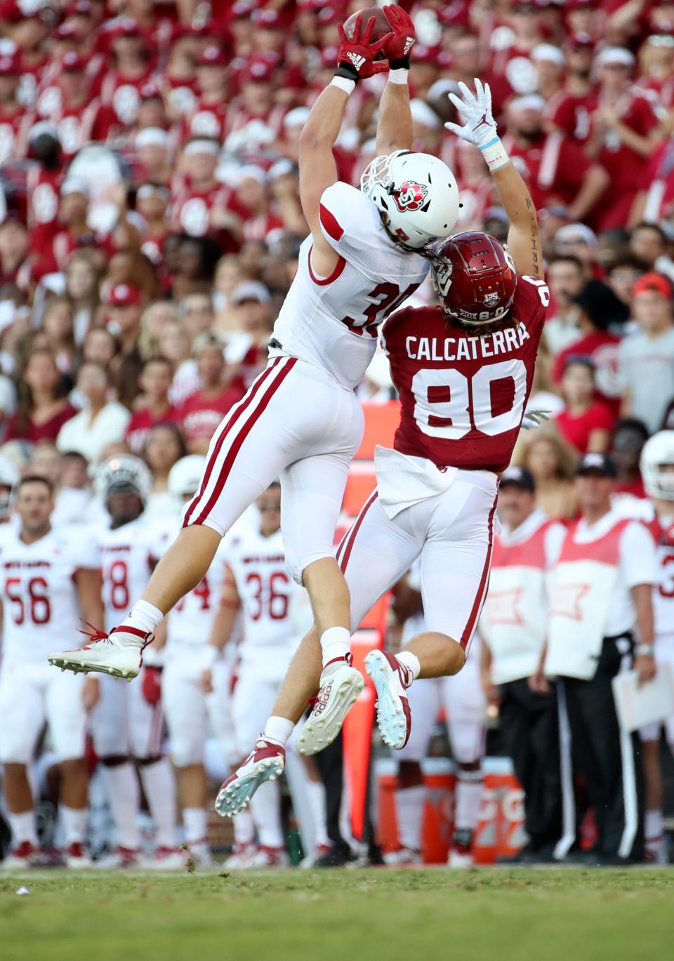 South Dakota linebacker Jack Cochrane (39) breaks up a pass intended for Oklahoma tight end Grant Calcaterra (80) in this file photo.