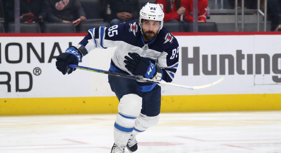 DETROIT, MICHIGAN - DECEMBER 12: Mathieu Perreault #85 of the Winnipeg Jets skates against the Detroit Red Wings at Little Caesars Arena on December 12, 2019 in Detroit, Michigan. (Photo by Gregory Shamus/Getty Images)