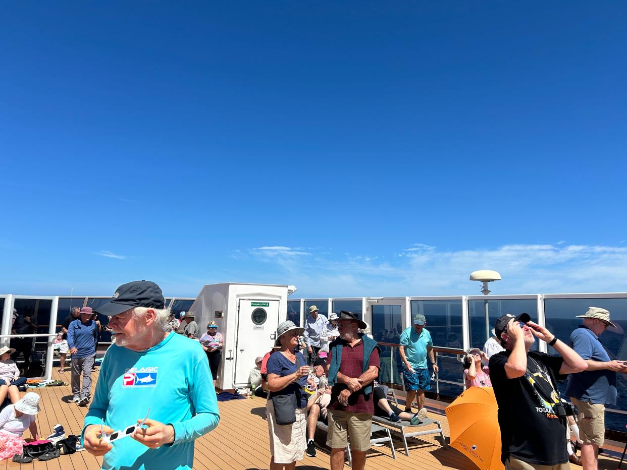 Passengers aboard Holland America's Koningsdam viewing the eclipse.