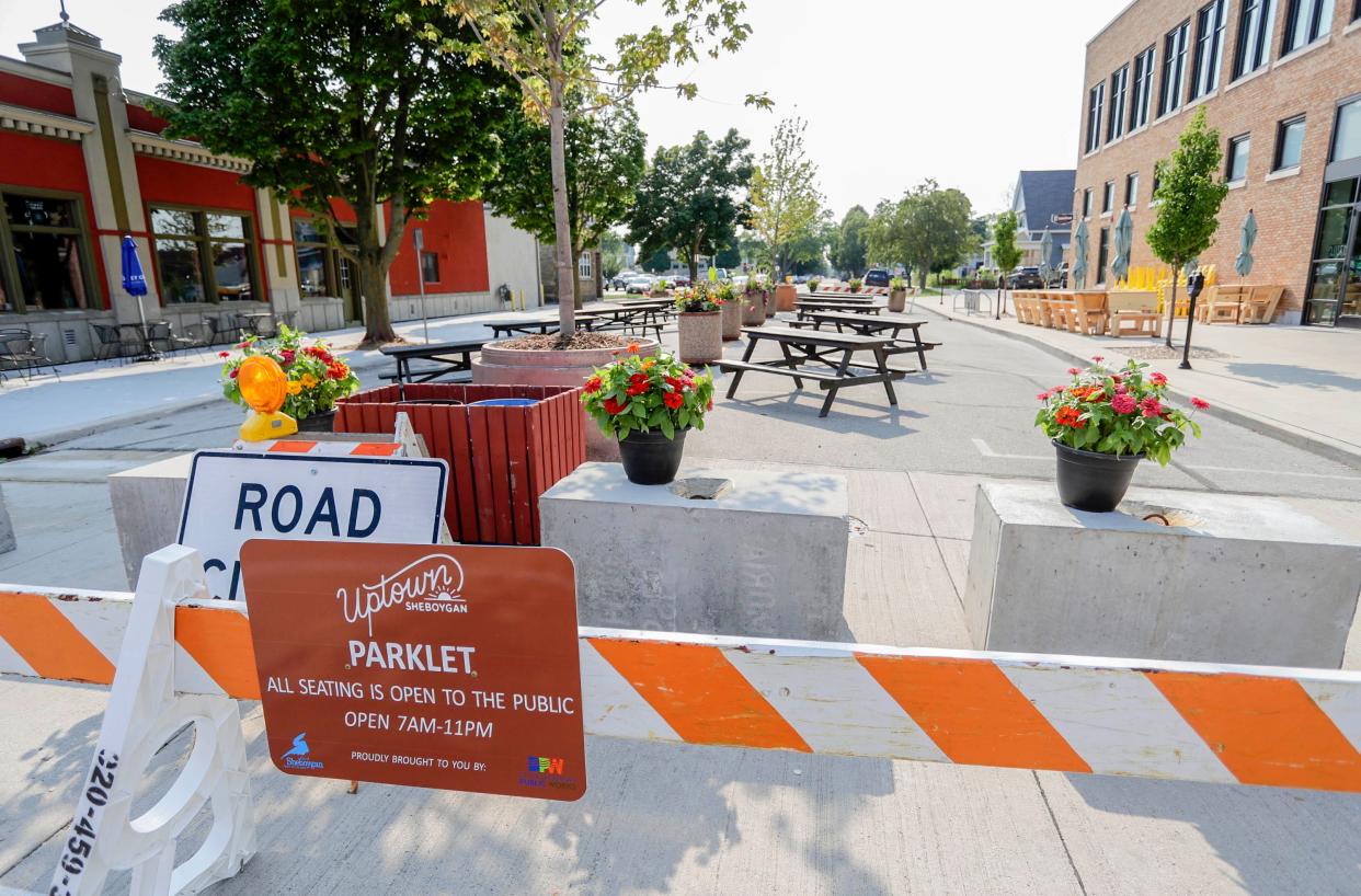 A section of St. Clair Ave. has been converted into a parklet as seen, Tuesday, July 27, 2021, in Sheboygan, Wis.