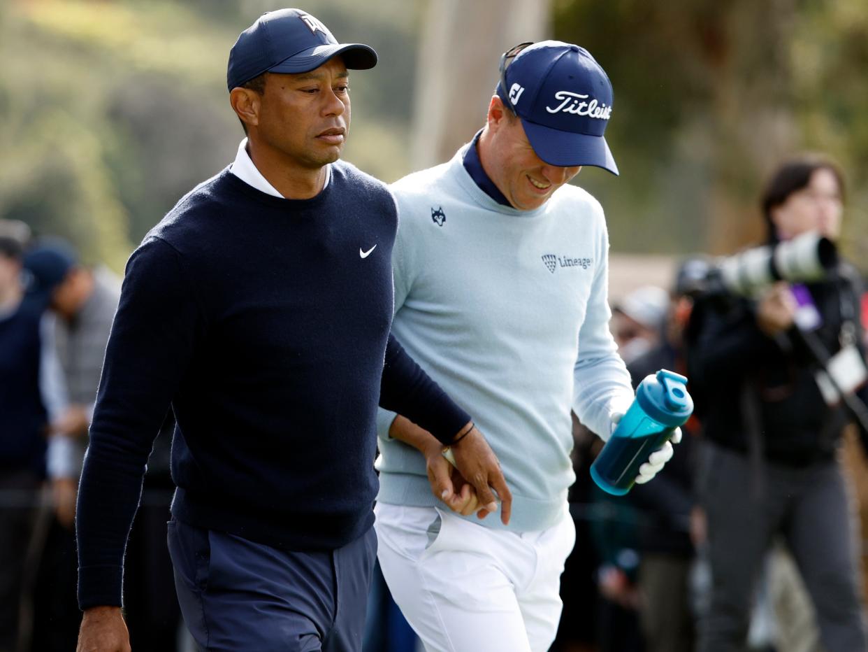 Tiger Woods and Justin Thomas at the Genesis Invitational. Tiger woods is seen handing Justin Thomas a tampon.