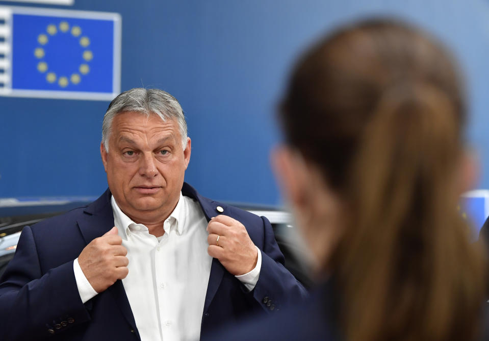 Hungary's Prime Minister Viktor Orban arrives for an EU summit at the European Council building in Brussels, Sunday, July 19, 2020. Leaders from 27 European Union nations meet face-to-face for a third day to assess an overall budget and recovery package spread over seven years estimated at some 1.75 trillion to 1.85 trillion euros. (John Thys, Pool Photo via AP)