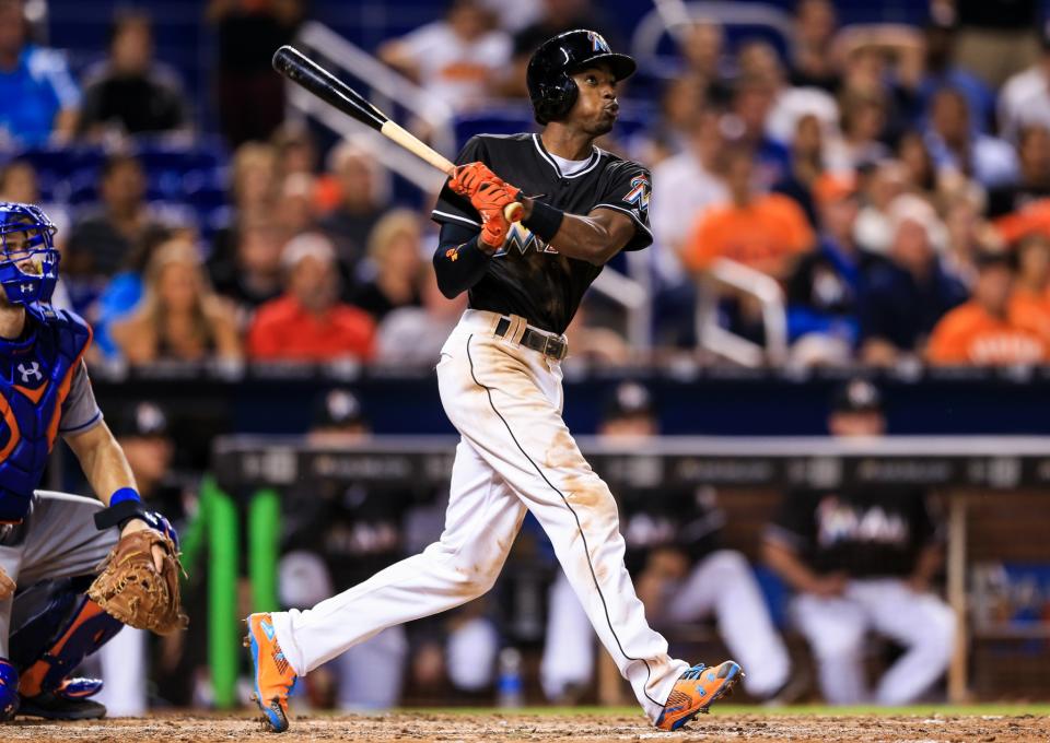 <p>Dee Gordon of the Miami Marlins at bat during the game against the New York Mets at Marlins Park on September 26, 2016 in Miami, Florida. Dee, a left handed batter, hit his first career home run on the second pitch of the game. For the first pitch, he wore Jose Fernandez’ batting helmet and stood in the right handed batter’s box to honor the late pitcher. (Photo by Rob Foldy/Getty Images) </p>