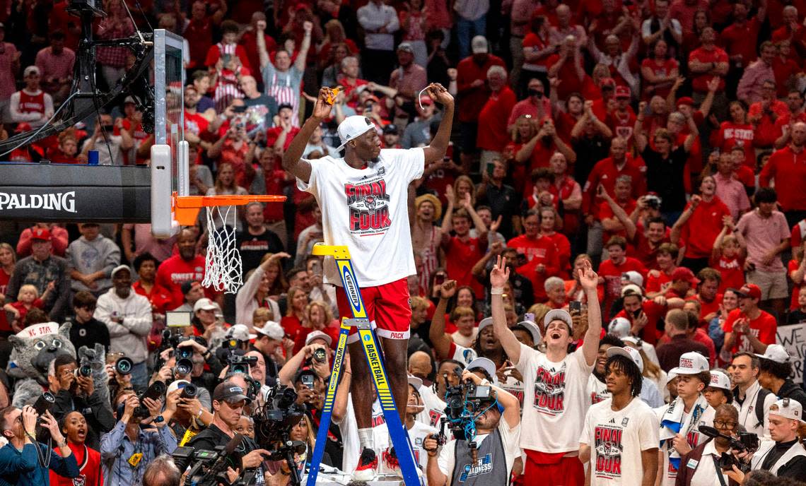 N.C. State’s Mohamed Diarra (23) acknowledges fans as he cuts down the net following the Wolfpack’s 76-64 victory over Duke, clinching the NCAA South Regional final and securing a spot in the Final Four on Sunday, March 31, 2024 at the American Airlines Center in Dallas, Texas. Robert Willett/rwillett@newsobserver.com