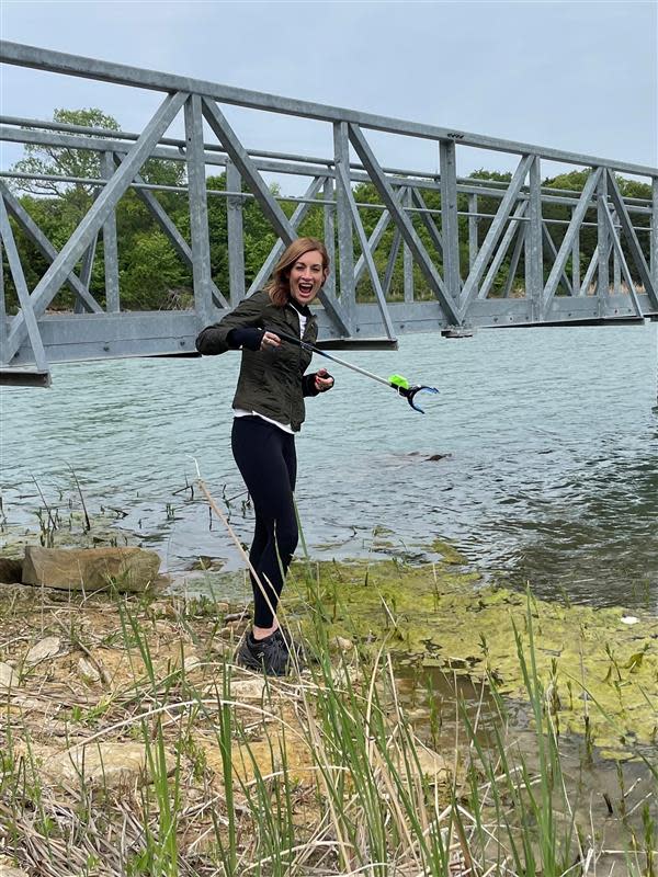 Shelley Zumwalt, executive director of the Oklahoma Department of Tourism and Recreation, helps during an Earth Day cleanup event last year.