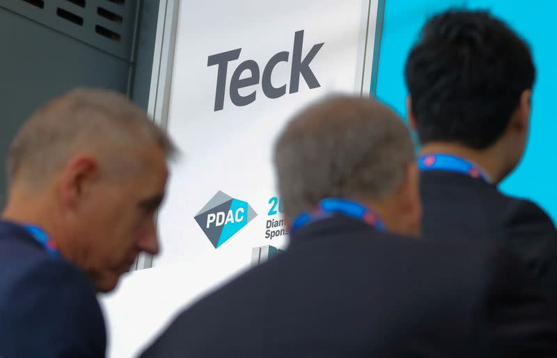 FILE PHOTO: Visitors pass a logo of Teck Resources Ltd mining company during the PDAC convention in Toronto