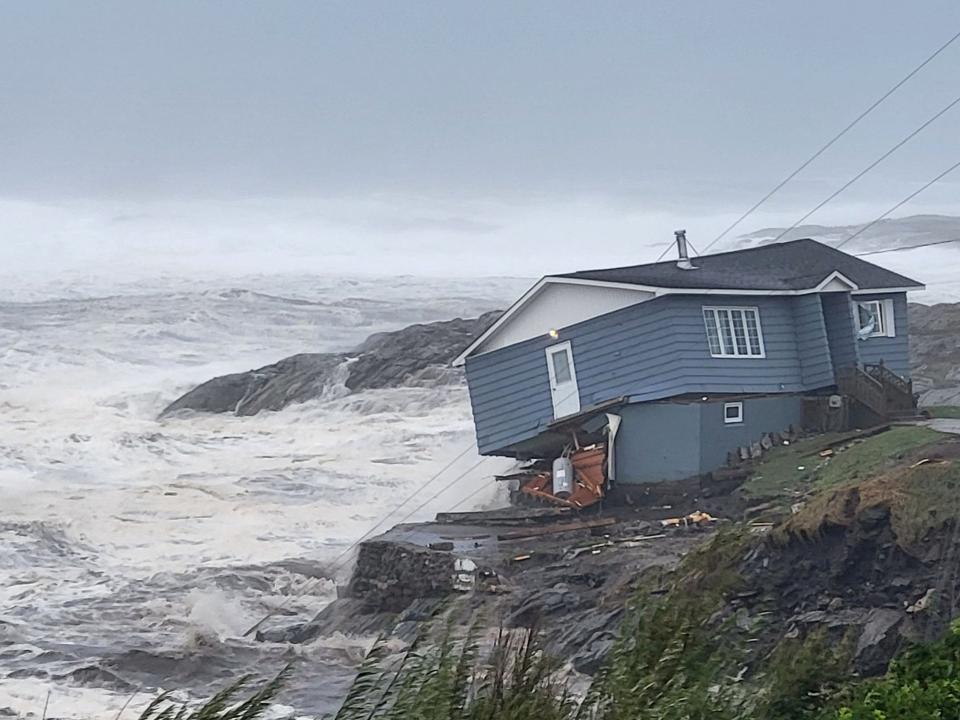 Homes have been destroyed near the sea during the tropical storm (via REUTERS)