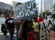 Demonstrators march to protest the police shooting of Keith Scott in Charlotte, North Carolina, U.S., September 26, 2016. REUTERS/Mike Blake