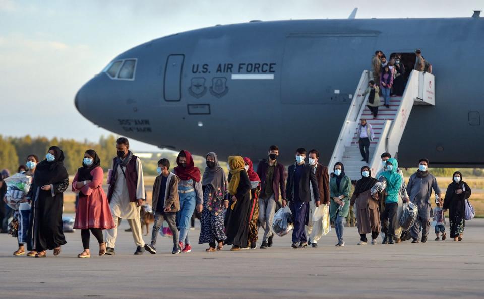 Younger teachers in particular want students to understand how 9/11 relates to current events like the U.S. withdrawal from Afghanistan in 2021. <a href="https://www.gettyimages.com/detail/news-photo/refugees-disembark-from-a-us-air-force-aircraft-after-an-news-photo/1234971225" rel="nofollow noopener" target="_blank" data-ylk="slk:Cristina Quicler/AFP via Getty Images;elm:context_link;itc:0;sec:content-canvas" class="link ">Cristina Quicler/AFP via Getty Images</a>