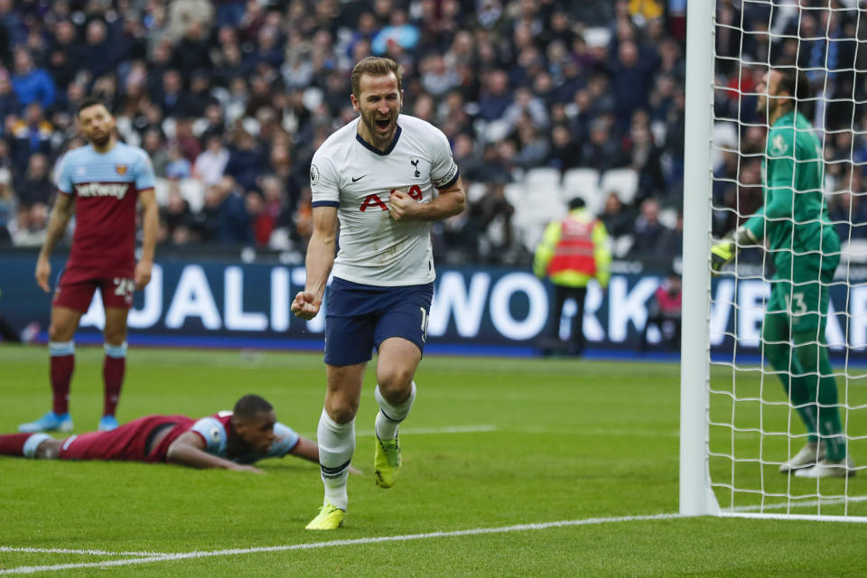 Tottenham's Harry Kane, center, celebrates after he scored his side's third goal during the English Premier League soccer match between West Ham and Tottenham, at London stadium, in London, Saturday, Nov. 23, 2019.(AP Photo/Frank Augstein)