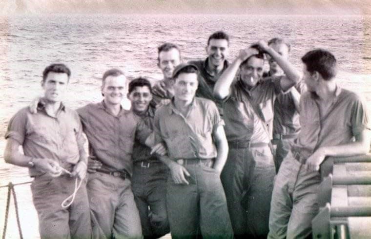 Somewhere in the Pacific Ocean, UDT unit 24 was all grins when Japan surrendered in 1945. Richard Hinson Jr. is in the back of the boat, middle, behind the man wearing a cap.