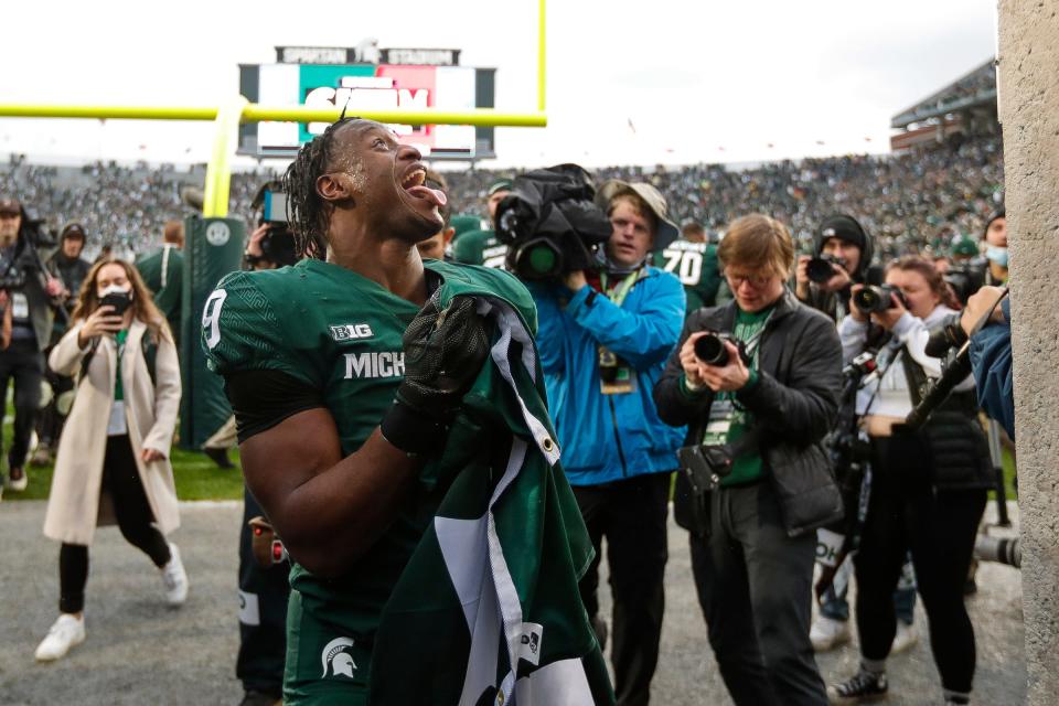 Michigan State running back Kenneth Walker III celebrates after his five touchdowns helped the Spartans to a 37-33 win over Michigan at Spartan Stadium in East Lansing on Saturday, Oct. 30, 2021.