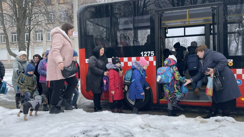 Children at the metro school take a bus from their old school to the subway station where they have in-person classes every other day. - Joseph Ataman/CNN