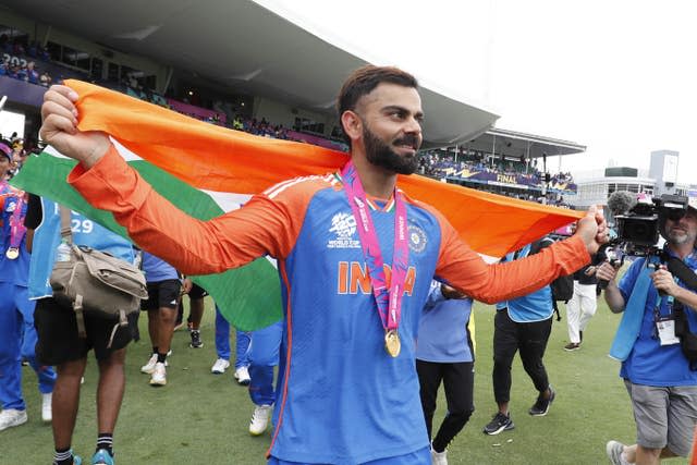 Virat Kohli celebrates with an India flag after victory in the T20 World Cup final