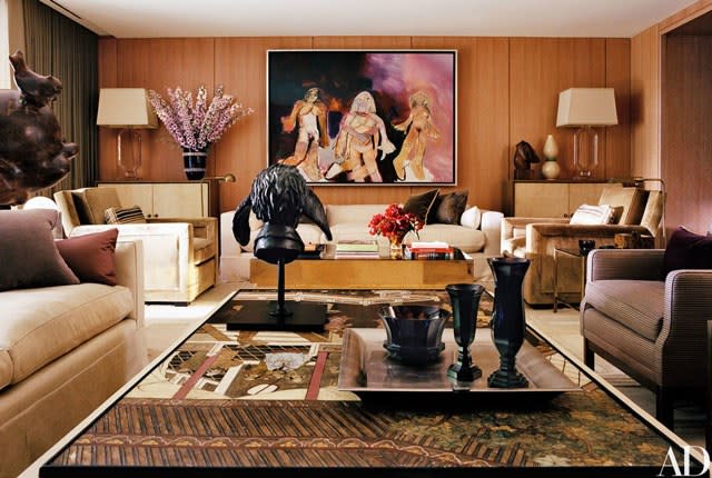 On the far side of the television room, a Richard Prince painting hangs above a brass Gabriella Crespi low table from Nilufar.