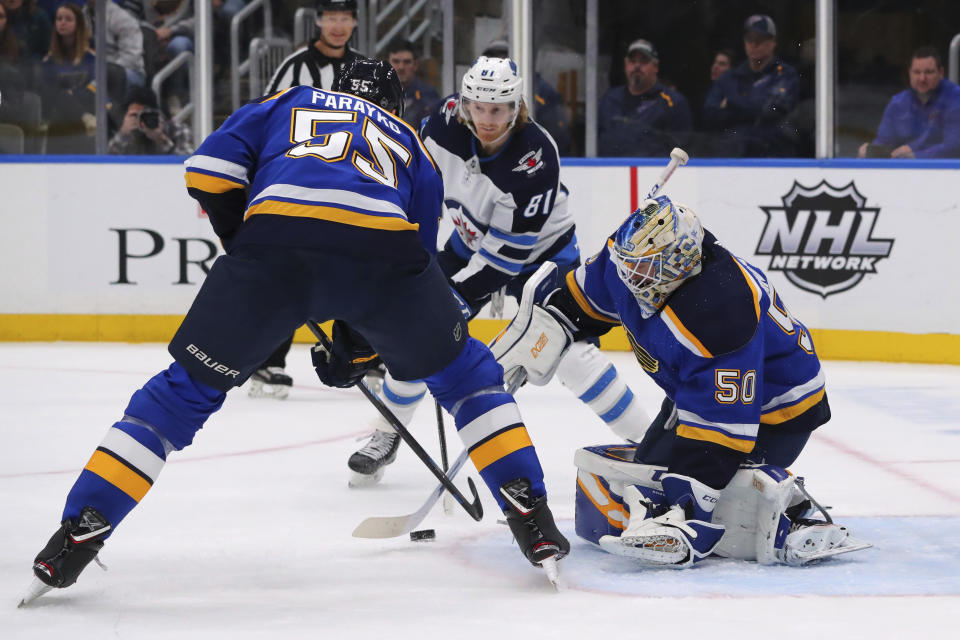 St. Louis Blues goalie Jordan Binnington (50) makes a save against the Winnipeg Jets during the first period of an NHL hockey game Sunday, Dec. 29, 2019, in St. Louis. (AP Photo/Dilip Vishwanat)